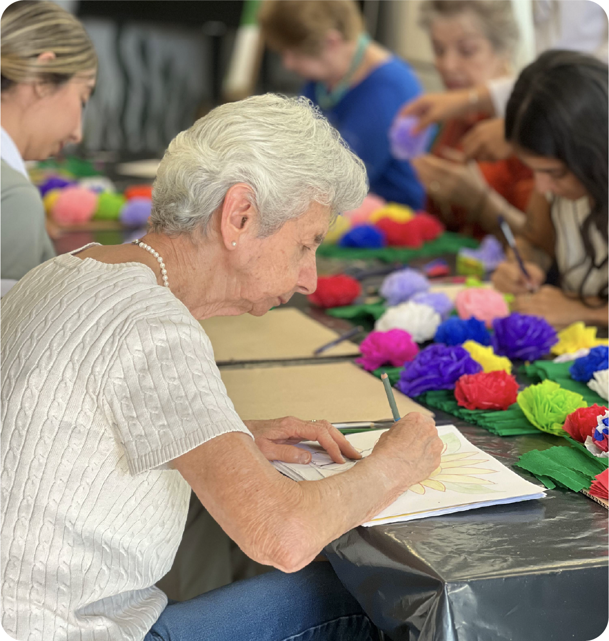 Resident enjoying a creative activity at Casa Nua